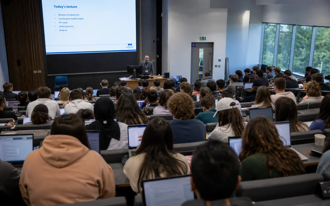 Students in a crowded university lecture hall